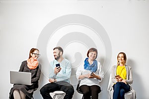People with gadgets on the white background