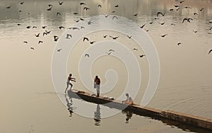 People gather to bathe at the Ghats photo