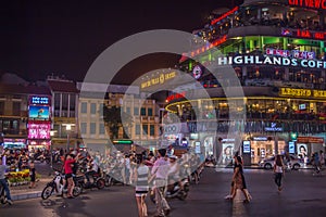 People gathering at Dong Kinh Nghia Thuc Square at night, Hanoi