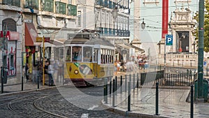 People getting on the tram timelapse, at a station in Luis de Camoes square photo