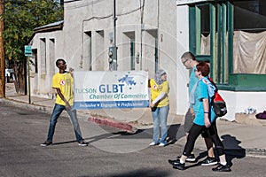 People with GLBT Chamber of Commerce Sign at AIDSwalk