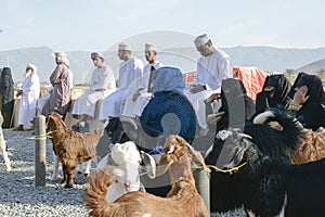 People at goat market in Oman