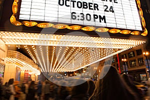 People going to cinema theater at the evening time.