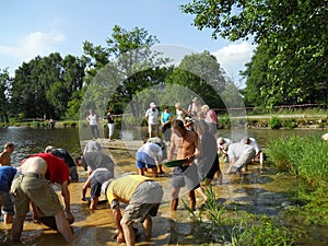 People gold panning