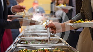 People group catering buffet food indoor in luxury restaurant with meat