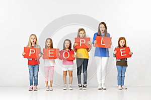 People. Group of children with red banners isolated in white