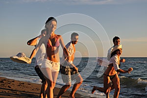 People group running on the beach