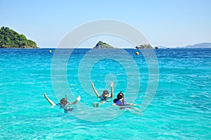 People group with snorkel on ocean