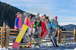 People Group With Snowboard Ski Resort Snow Winter Mountain Cheerful Friends Sitting On Wooden Hence Talking