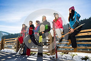 People Group With Snowboard Ski Resort Snow Winter Mountain Cheerful Friends Sitting On Wooden Hence Talking