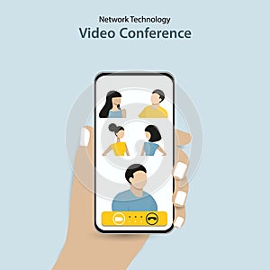 People group talking together on video conference app phone call. Hand holding phone showing faces. Collective mobile team group c