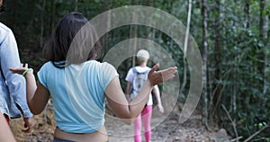 People Group Walking In Forest, Tourists Talking On Hile Trekkking Route In Woods Mix Race Friends Together Hiking