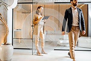 People in the hallway of creative studio office