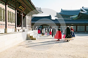 Gyeongbokgung palace and people with Hanbok Korean traditional clothes in Seoul, Korea