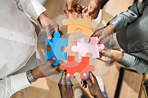 People Hand Holding Colorful Puzzle