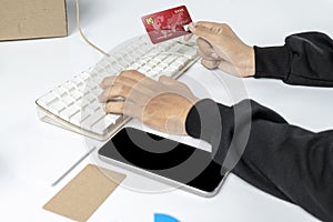 People hand holding credit cards with empty screens mobile phones for mobile payment, banking, or online shopping