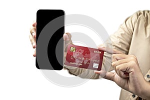 People hand showing credit cards and mobile phones with empty screens for mobile payment, banking, or online shopping