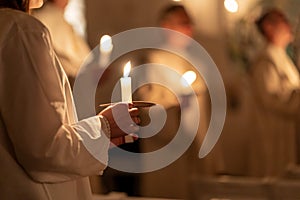 People handling candles in the hands. Christmas and lucia holidays