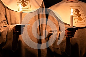 People handling candles in the hands. Christmas and lucia holidays in Sweden