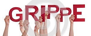 People Hands Holding Word Grippe Means Flu, Isolated Background photo