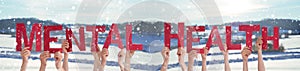 People Hands Holding Word Mental Health, Snowy Winter Background