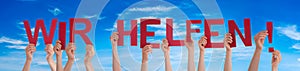 People Hands Holding Word Wir Helfen Means We Help, Blue Sky