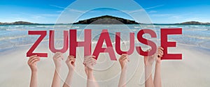 People Hands Holding Word Zuhause Means Home, Ocean Background