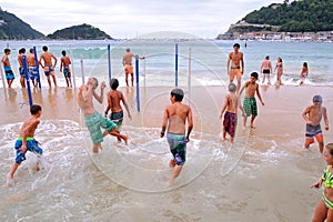 People have fun at the Donostia La Concha beach