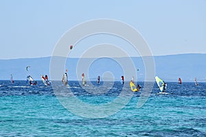 People are having an active pastime on vacation. Surfing on an Adriatic sea in Croatia.