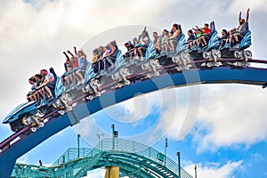 People having fun extreme roller coaster ride. at Seaworld in International Drive area 13