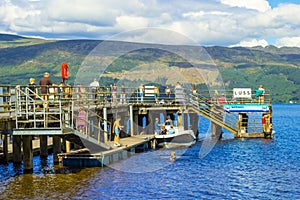 People having fun on a sunny day at the Luss Pier, Loch Lomond, Argylle and bute, Scotland, 21 July, 2016