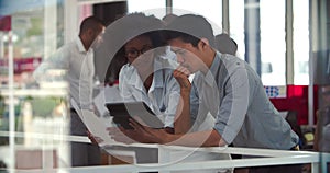 People Having Informal Meeting In Modern Open Plan Office