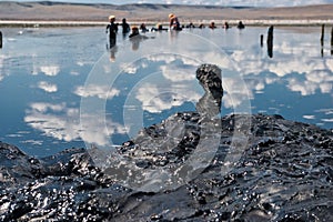 People having mud bath