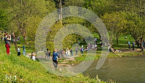 People having a picnic, taking photo, lying on grass and having a good time on the shore of Lake Golcuk | Golcuk Golu.