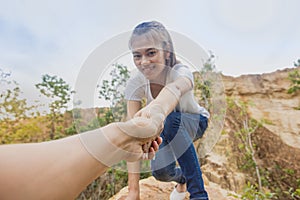 People helping each other hike up a mountain, Giving a helping h