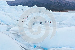 People hiking at Perito Moreno Glacier in the Los Glaciares National Park, Santa Cruz Province, Patagonia Argentina.