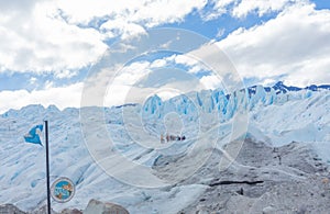 People hiking at Perito Moreno Glacier in the Los Glaciares National Park, Santa Cruz Province, Patagonia Argentina.