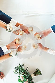 People hold in hands glasses with white wine. wedding party.