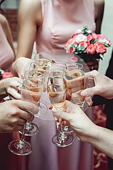 People hold in hands glasses with white wine. wedding party.