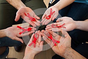 People holding aids ribbon