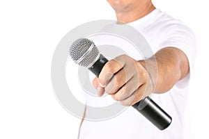 People holding black wireless microphone in studio. Isolated on white