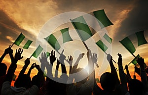 People Holding Flag of Nigeria in Back Lit
