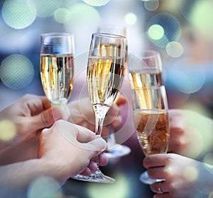 People holding glasses of champagne making a toast