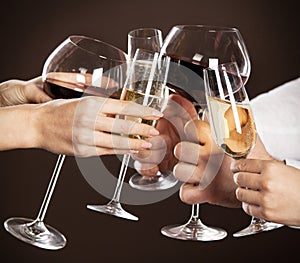 People holding glasses of white wine photo