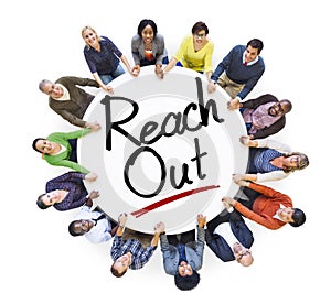 People Holding Hands Around the Word Reach out photo