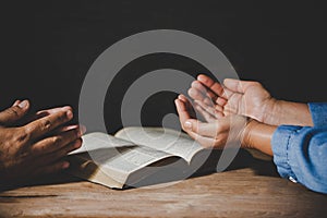 People holding hands praying worship believe