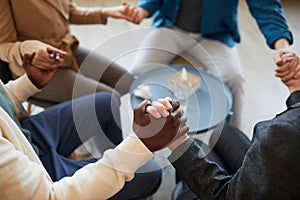 People Holding Hands in Support Group Background