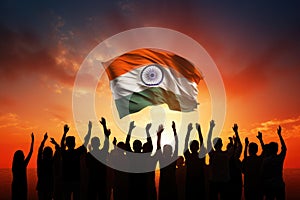 People Holding India Flag in the Air with a Dramatic Sunset Background, Silhouette of a group of people waving Indian flags in