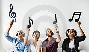 People holding musical notes icons