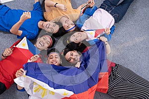 People holding philippines flag celebrating independence day